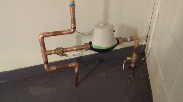 Water meter re-pipe