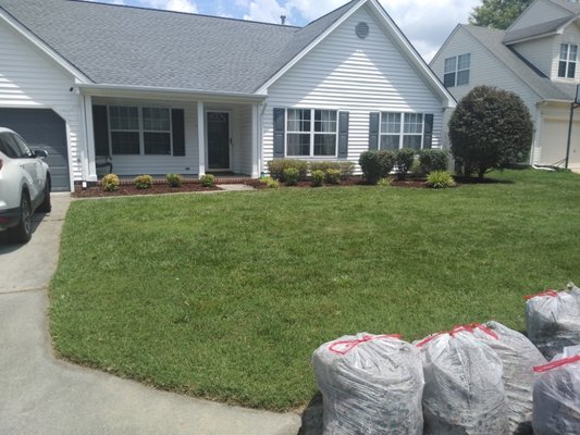 Clean up flower beds trimmed bushes