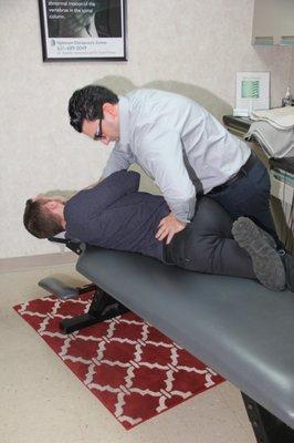 Dr. Brandon adjusting one of our awesome clients