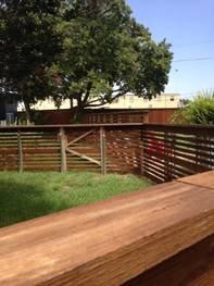 Open horizontal fence.
 Good for ventilation of interior.