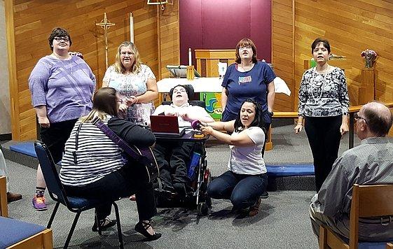 members of the "Joyful Singers" at one of their concerts.