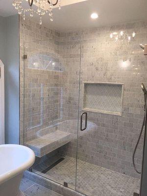 Full bathroom remodeling included tile walls and floor.