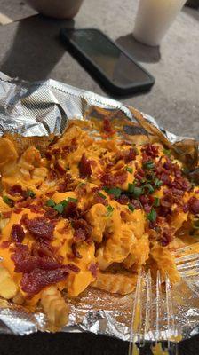 loaded fries with crispy bacon, american cheese and scallions