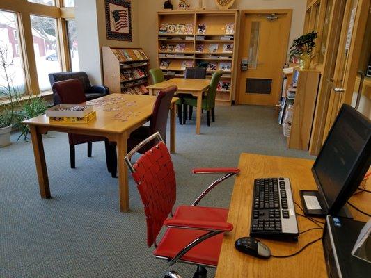 Sunlit side room with tables, Baileys Harbor Library.