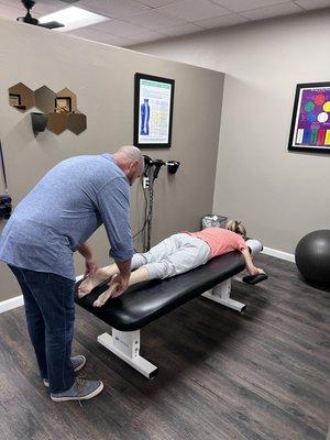 Dr O'Dell adjusting a patient before her laser treatment