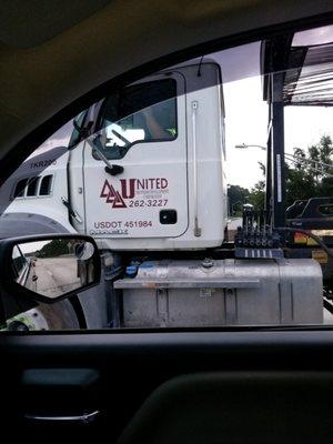 United Brothers Development is a danger to the public!  This truck is clearly spilling debris all over the highway!