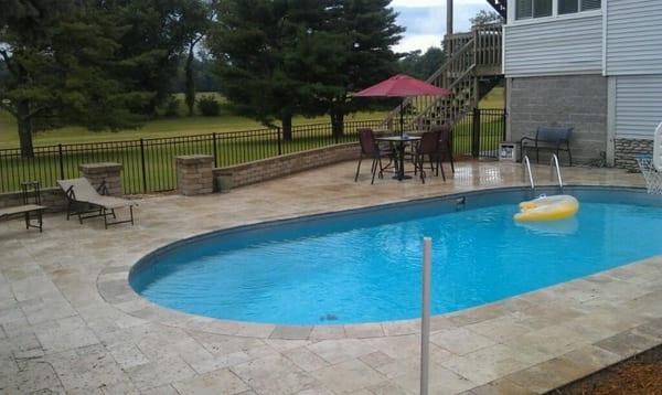 This was a 1980 steal Pool that we did an overlay with Travertine to update the outdoor living area. looks good!