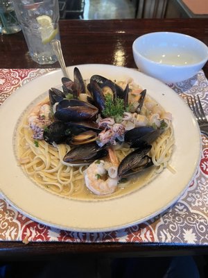 Shrimp, scallops, calamari,mussels, and pasta in a white sauce.