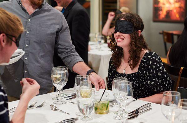 A young couple enjoying the blindfold course.