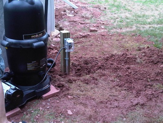 Installed an underground feed from the breaker panel to the outside pool.