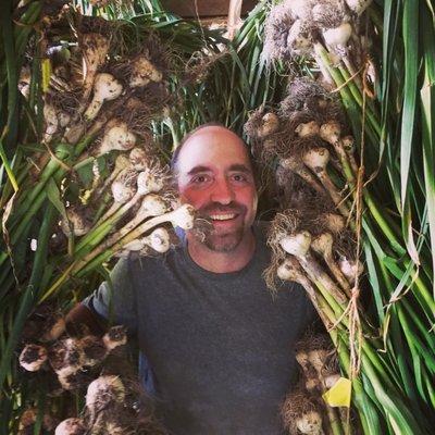 Farmer Jason checking on the gourmet garlic curing in the barn!