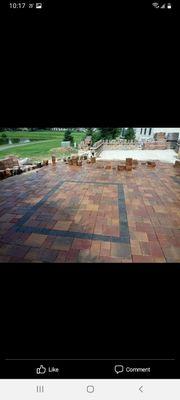 Paver patios under construction.