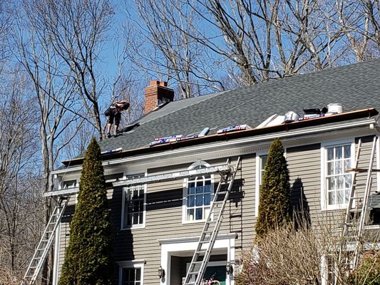 ENH Roofing strip down and Gaf Hdz 50 year shingles , Crew at work , completed in one day .