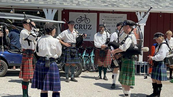 Nauvoo Pageant bagpipe band in front for Nauvoo Market Place and Crüz Nauvoo