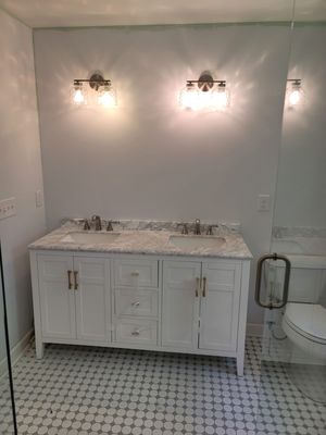 2.Contentious project Remodeling into a Modern bathroom by our team.