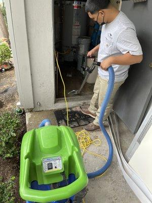 Water extraction of water heater room. Our technician Daniel hard at work!