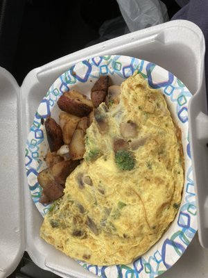 Cheese, mushroom and broccoli omelet with the best home fries in the area. Very well packaged.