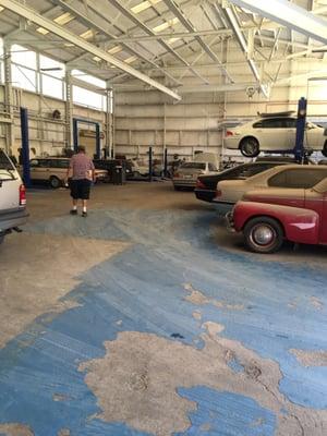 Ron in the picture! Garage full of cars being worked on