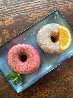 Artisan yeasted donuts, offered on Saturdays with weekly flavors.  These are raspberry-lavender and orange-cycle