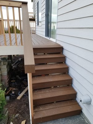 Deck for client tear off recover with trex decking and new railing .