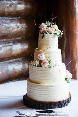 Flowers from Mary for our delicious cake at our reception. Cake made by Pastry Chef Mo.  Photo Credit:  Juancho SC Photography