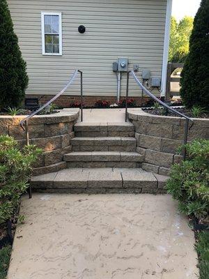 Flared railings installed down back steps.