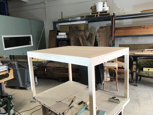 Solid clear fir top on hard maple base. Top to be oiled, base to be painted and glazed.