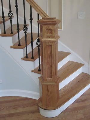 custom stair construction with pentagon newel post by Splash Carpentry, Chicago IL