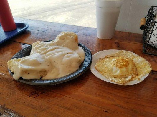 Biscuit with gravy and two fried eggs. The food is reiculously inexpensive. Such a good deal and good food.