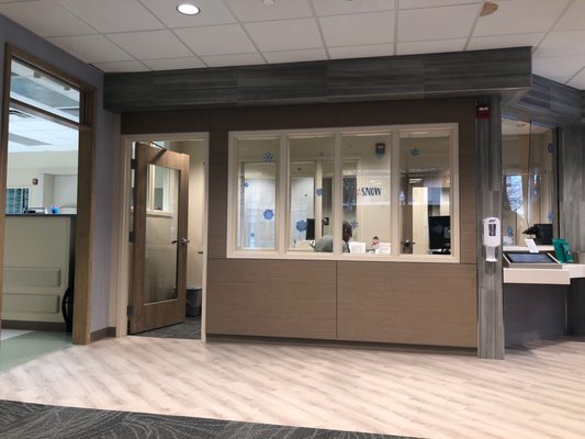 Reception desk with digital check in screens