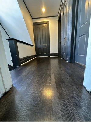 Ebony stain on red oak flooring with 3 coats waterbase finish.