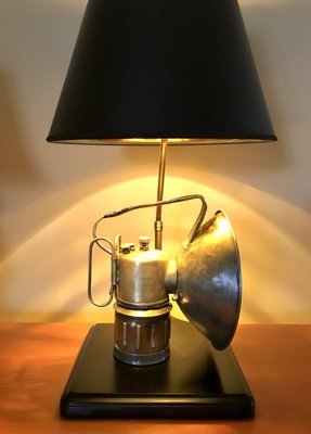 Antique brass carbide light, restored and made into a desk lamp.