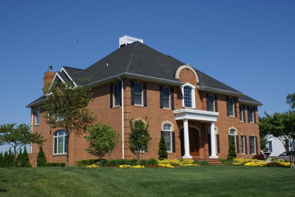 The Home's main hip roof terminates in an Owner requested "Widow's walk. The reverse gable roof on the end wall breaks up the...