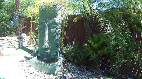 Our Tiki fountain on the golf putting green adds a great touch to the tropical backyard.