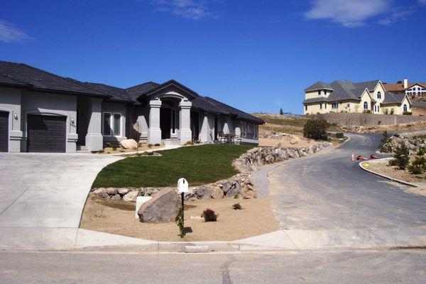 Rock retaining wall with grass