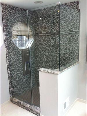 3/8" frameless glass shower with door, notched panel and return panel on knee wall