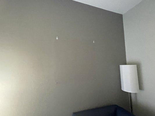 Holes in the walls from where a picture should be hung up