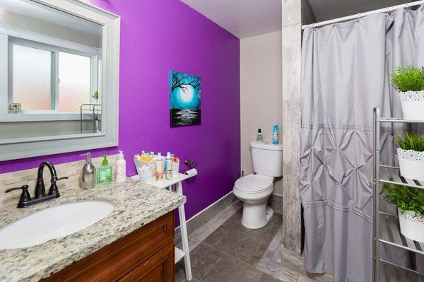 Bathroom with a fun purple wall