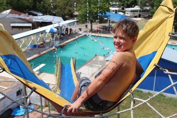 A junior olympic-size swimming pool and giant water slide provide lots of fun during the hot Texas summer!