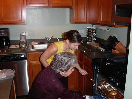 Caregiver helping client make Thanksgiving dinner.