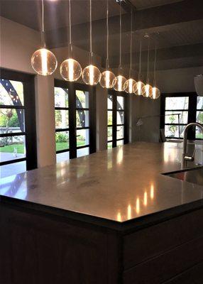 Custom Kitchen - Urban Hacienda island detail.  No need to skimp on pendant lighting - make a statement!