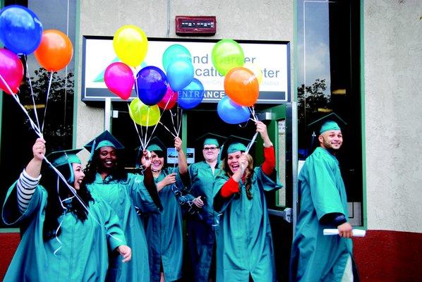 Graduates from class of 2017 celebrate outside of our main entrance.