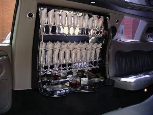 16 passenger SUV, complimentary bar service, mixers and lots of ice for a party on wheels.  Leather seating for comfort & style