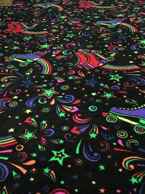 custom glow-in-the-dark carpet installed in this skate rink!!