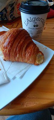 Delicious coffee and croissant