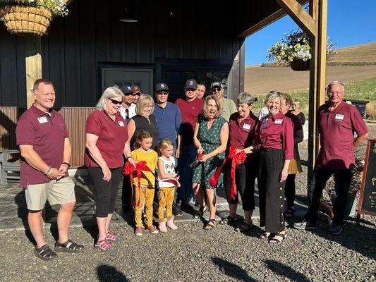 Our ribbon cutting with our daughters, and team.