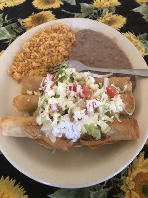 Flautas     3 chicken or ground beef flautas topped with lettuce and tomatoes with side of beans, rice, and sour/ Mexican cream