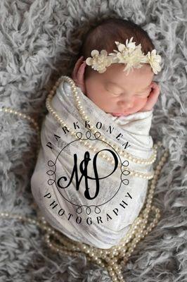 Newborn baby with pearls