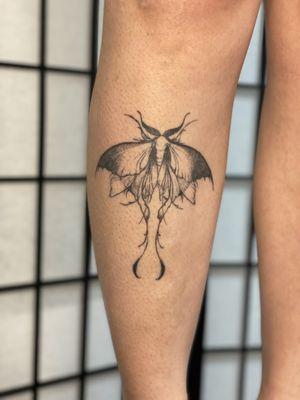 Healed moth tattoo