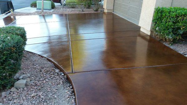 Stained driveway, sealed with clear polyurethane with slip resistance granules.